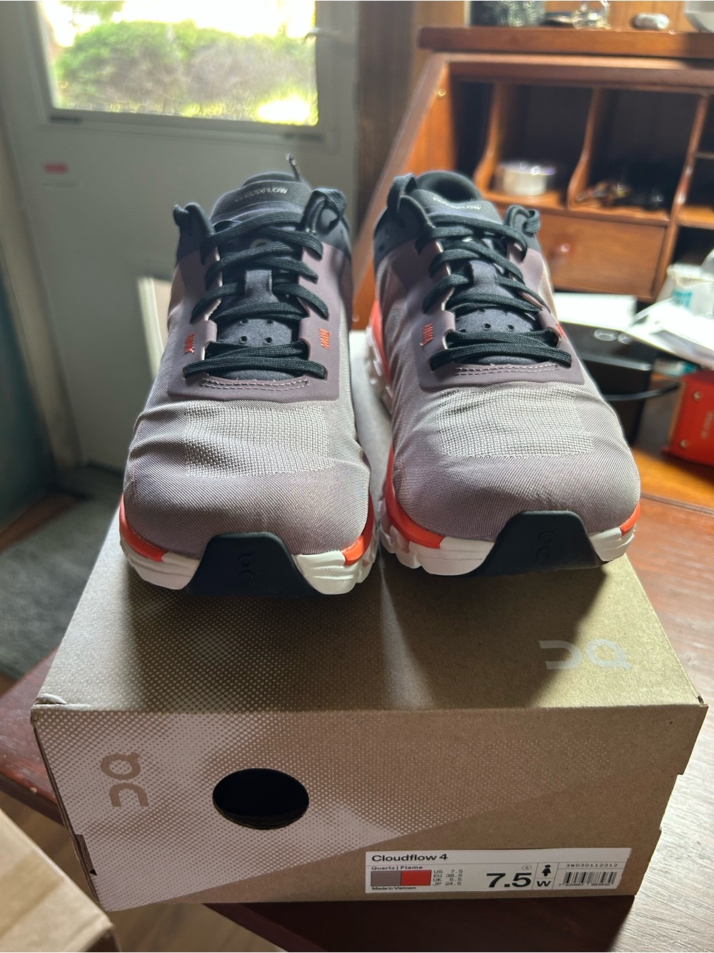 On Running Women’s Cloudflow 4 — Gray with Orange Accents
